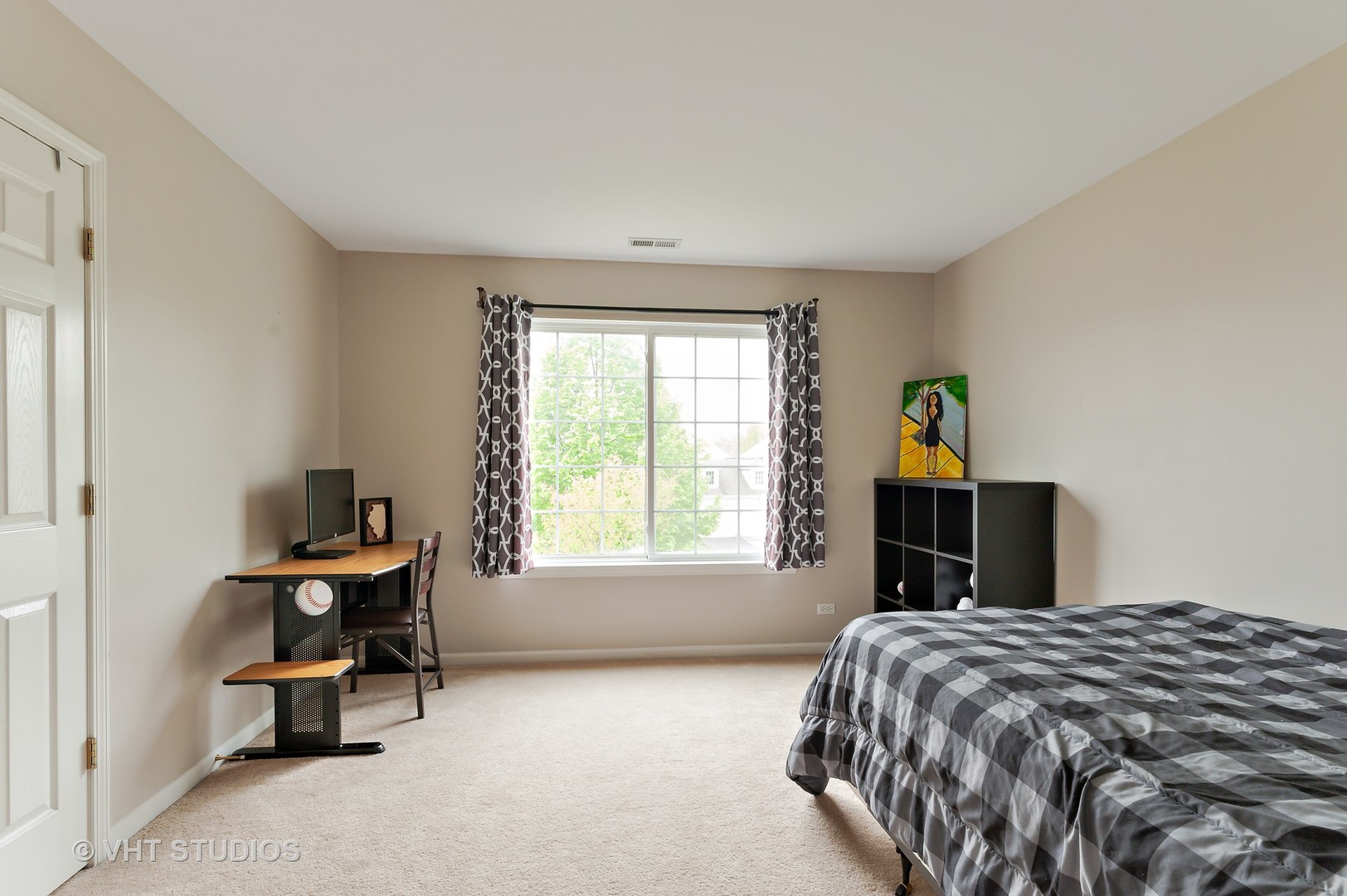 86 Amberly Drive Round Lake, IL 60073 - Photo 9 of 12 a bedroom with a bed and a window