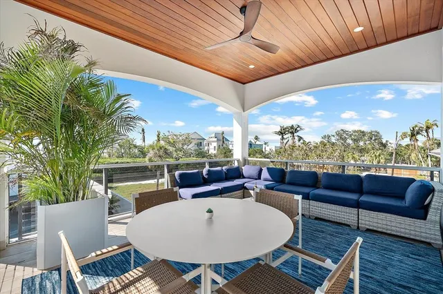 a view of a balcony with lake view and a potted plant