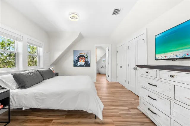 a bedroom with a bed and a table in it