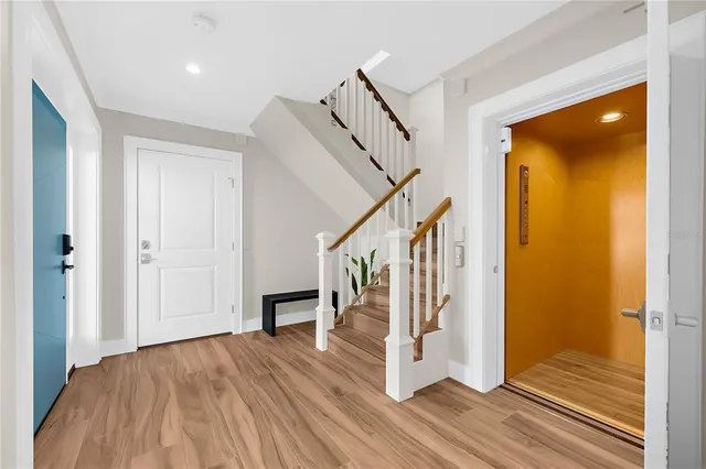 a view of entryway with wooden floor and stair
