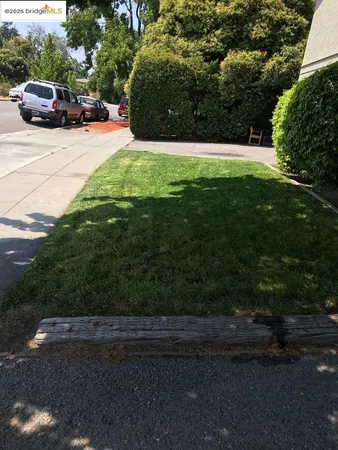 a view of street with parked cars