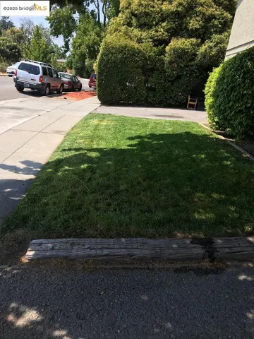 a view of street with parked cars