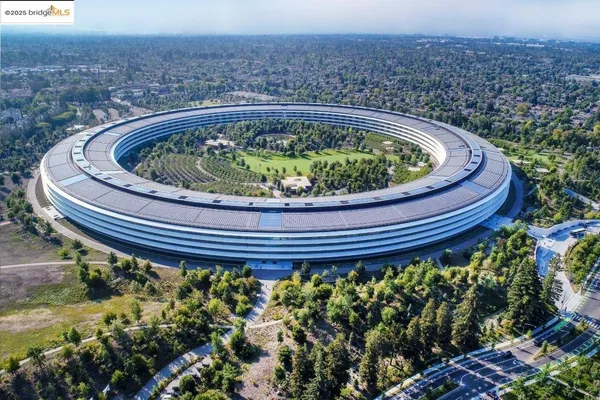 a small pool with trees in the background