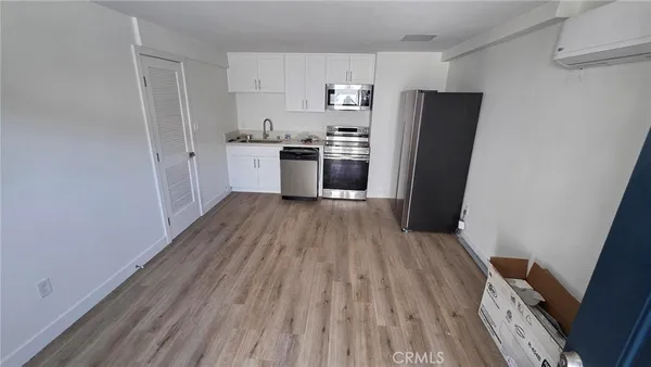 a kitchen with a refrigerator a sink and dishwasher