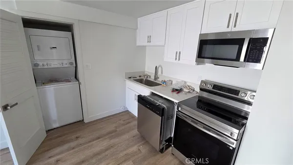 a kitchen with a stove and a microwave