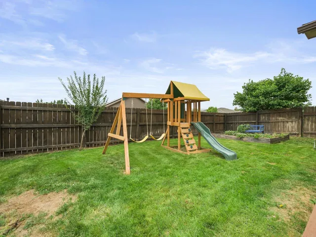 a view of garage and yard
