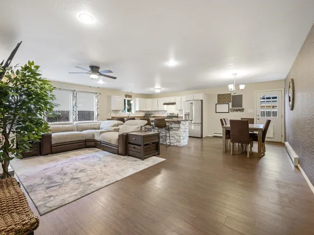 a living room with furniture window and wooden floor