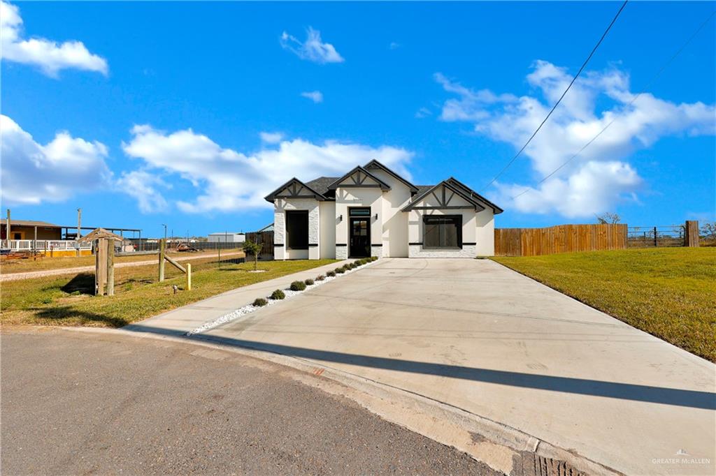 23264 North Skinner Road Edcouch, TX 78538 - Photo 1 of 1 View of front facade with a front yard