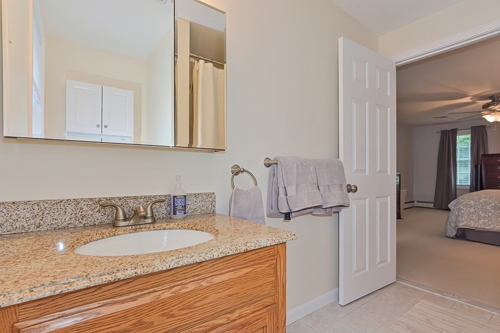 5 Centennial Drive Blackstone, MA 01504 - Photo 15 of 24 a bathroom with a granite countertop sink and a mirror