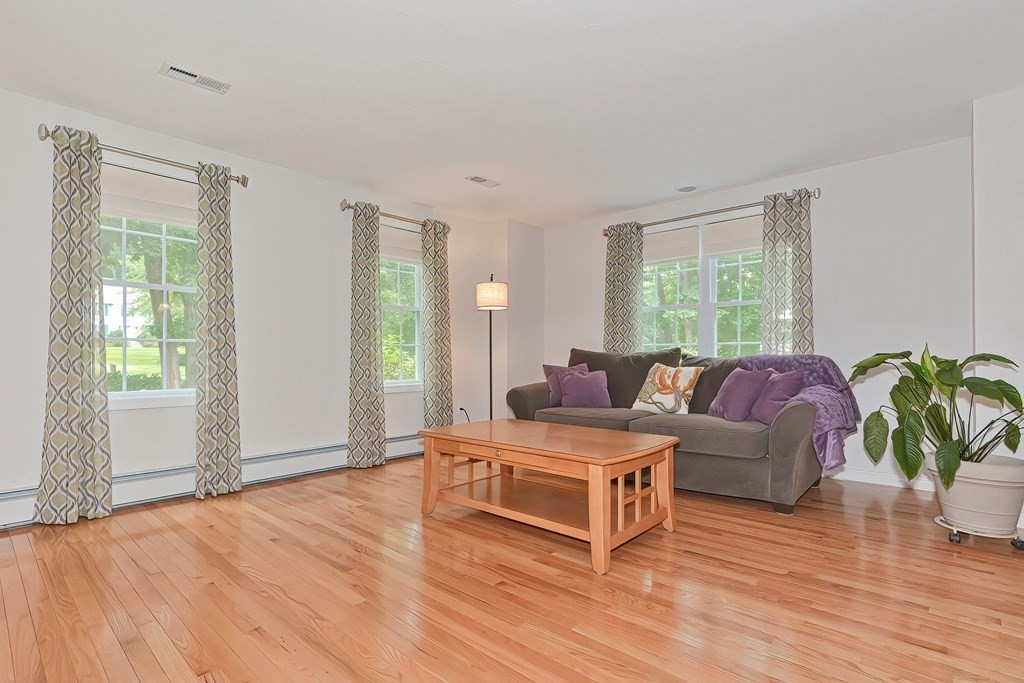 5 Centennial Drive Blackstone, MA 01504 - Photo 10 of 24 a living room with furniture and a wooden floor