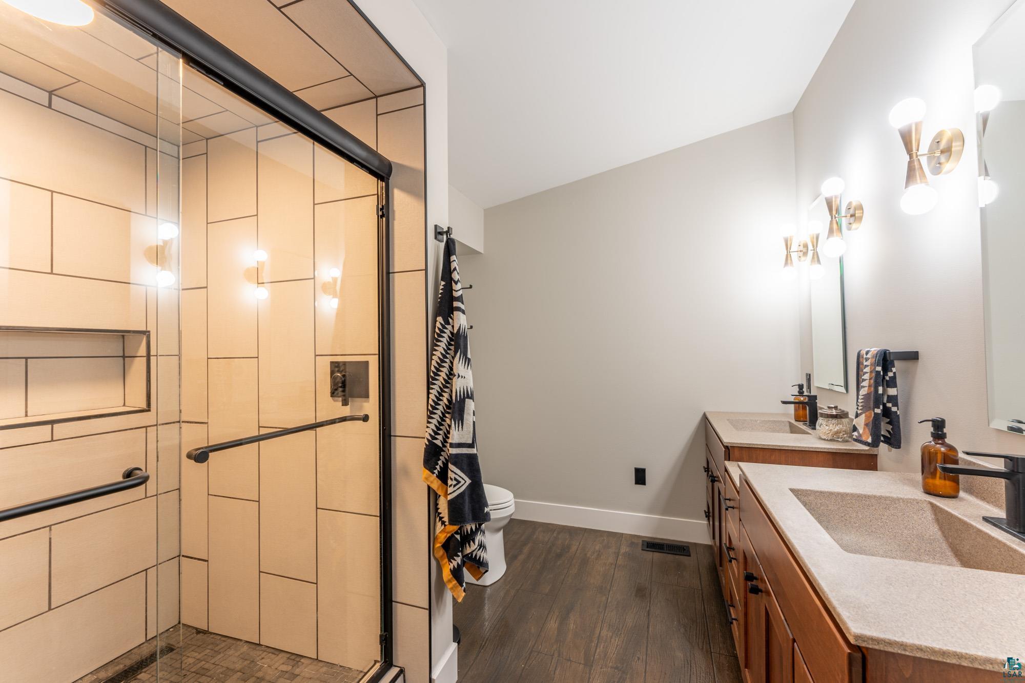 14635 Canadian Border Road Ely, MN 55731 - Photo 54 of 94 Walk-in shower with light-toned rectangular tile surround and built-in niche