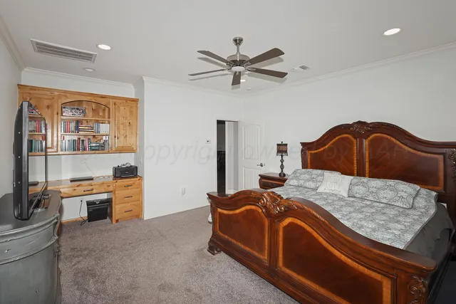 a bedroom with a bed and dresser