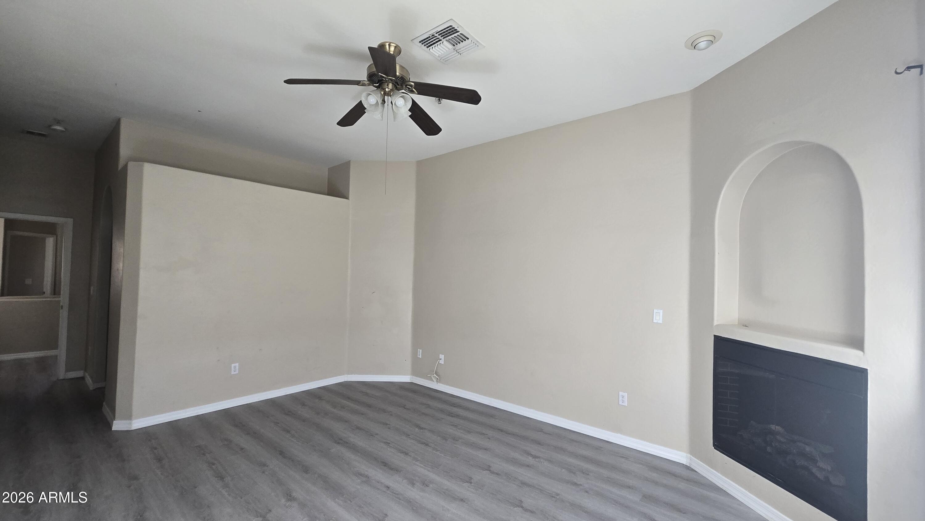 7528 North 19th Avenue, Unit 9 Phoenix, AZ 85021 - Photo 13 of 18 wooden floor in an empty room with a window