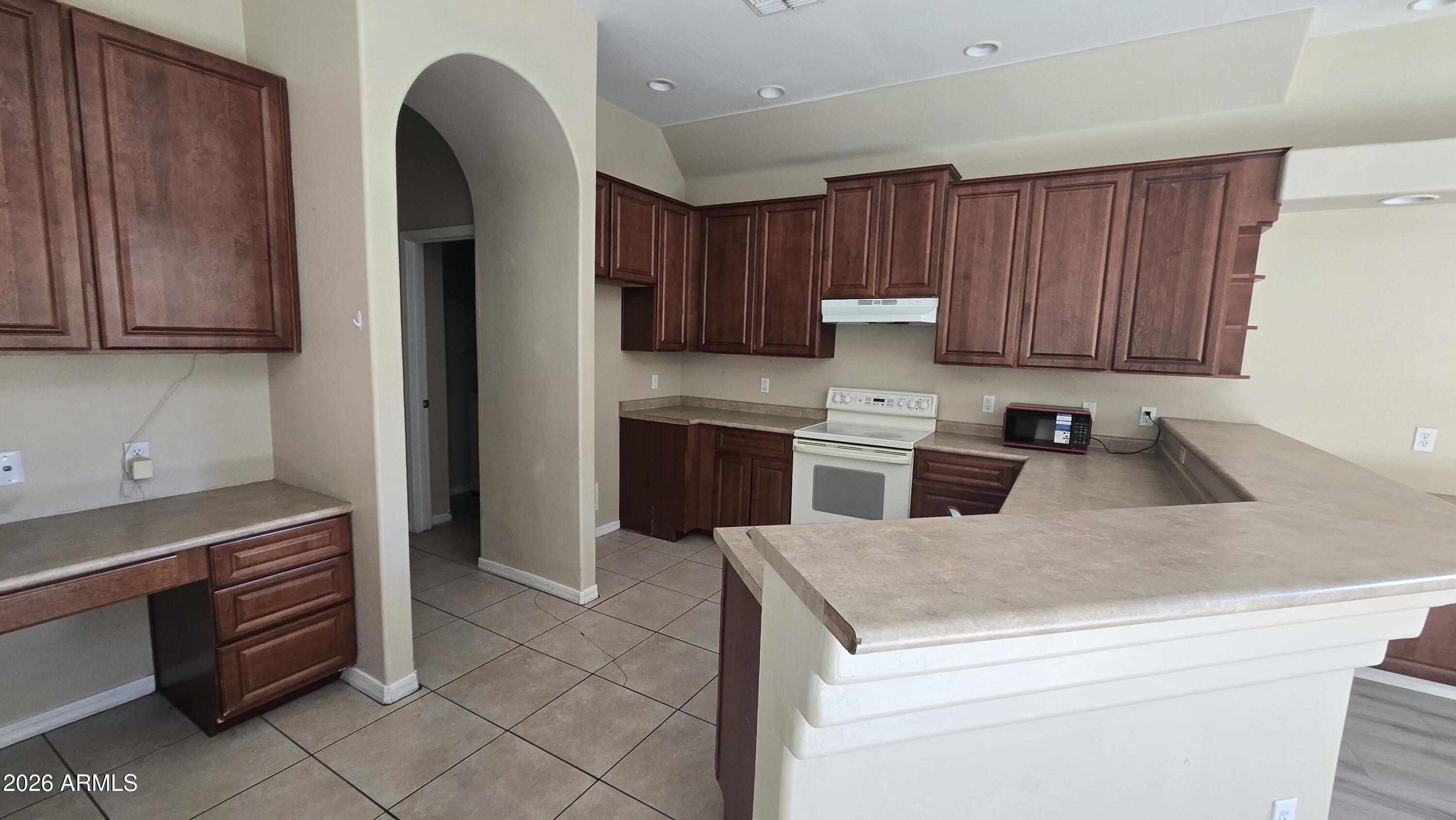 7528 North 19th Avenue, Unit 9 Phoenix, AZ 85021 - Photo 17 of 18 a kitchen with a cabinets and appliances