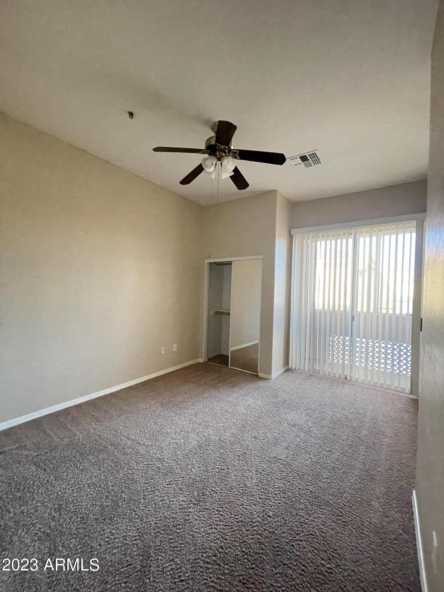 7528 North 19th Avenue, Unit 9 Phoenix, AZ 85021 - Photo 2 of 12 a view of an empty room with a window