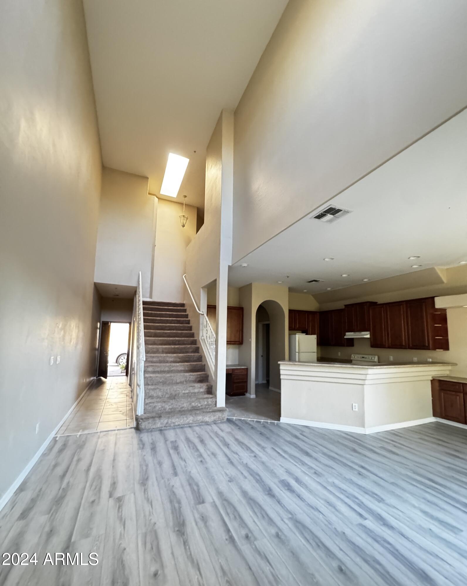 7528 North 19th Avenue, Unit 9 Phoenix, AZ 85021 - Photo 5 of 18 a view of empty room with wooden floor