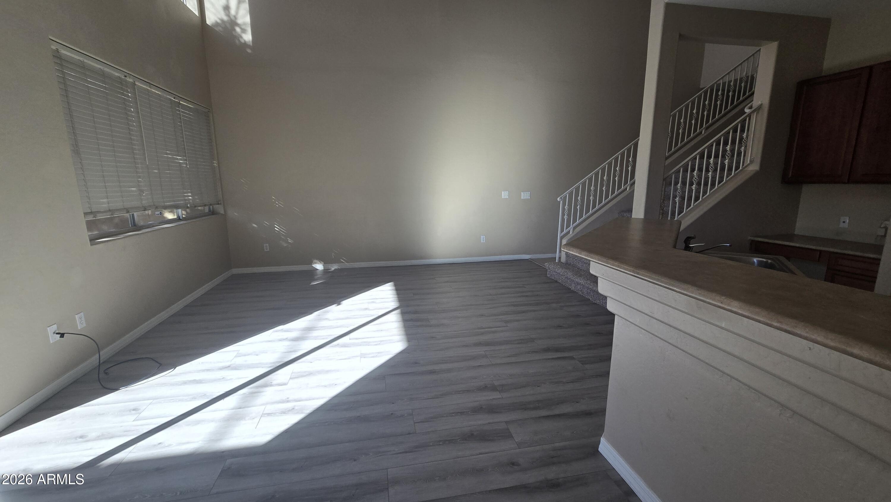 7528 North 19th Avenue, Unit 9 Phoenix, AZ 85021 - Photo 9 of 18 a view of entryway and hall with wooden floor