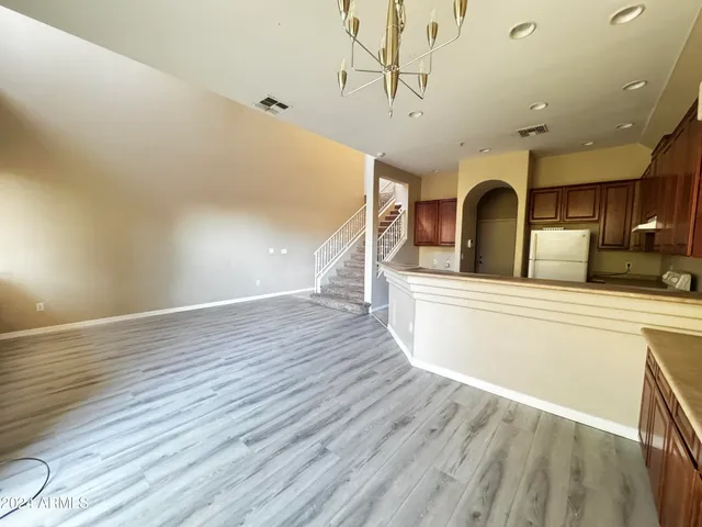 a view of kitchen with furniture and wooden floor