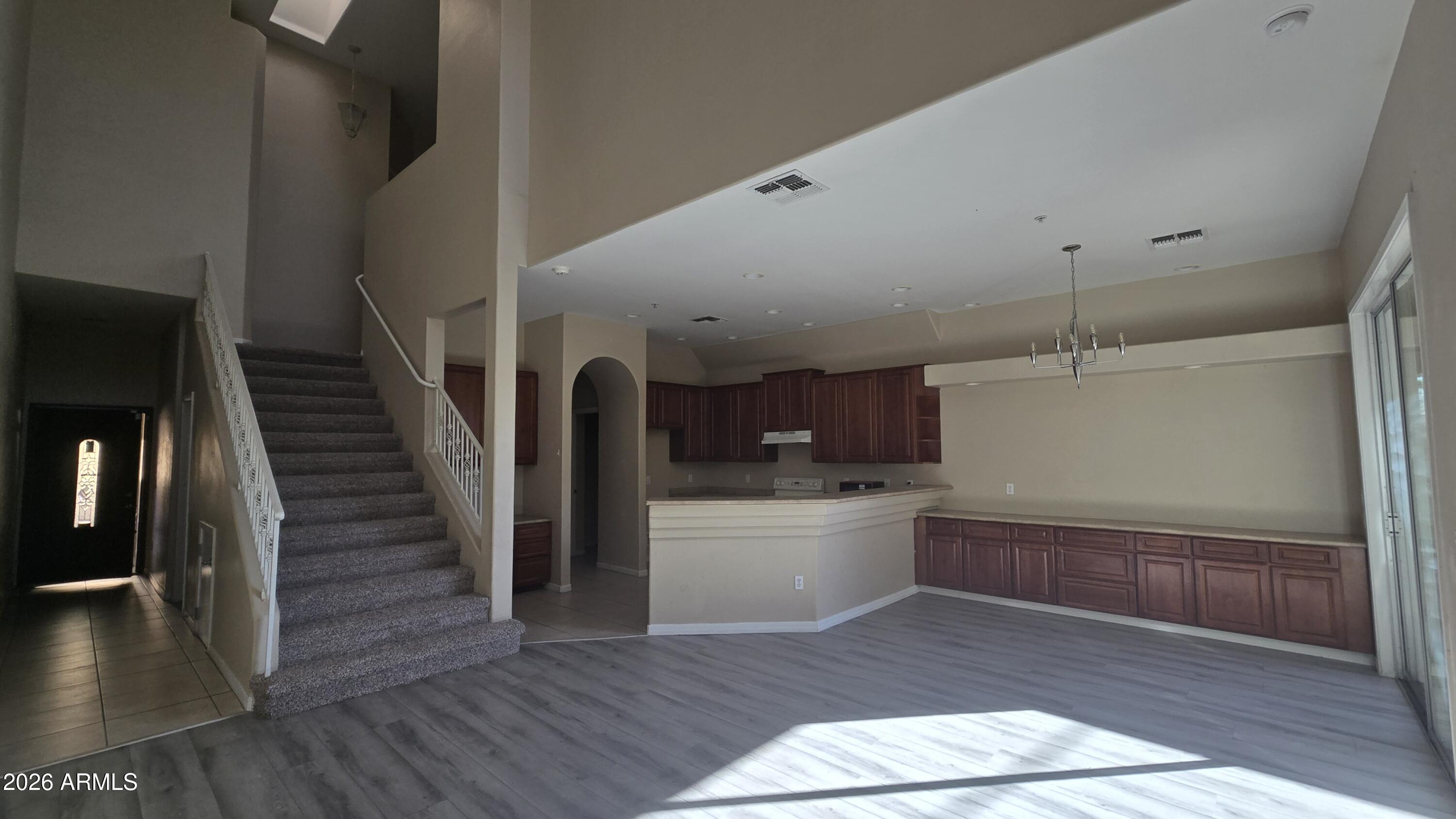 7528 North 19th Avenue, Unit 9 Phoenix, AZ 85021 - Photo 10 of 18 a view of entryway and kitchen with wooden floor