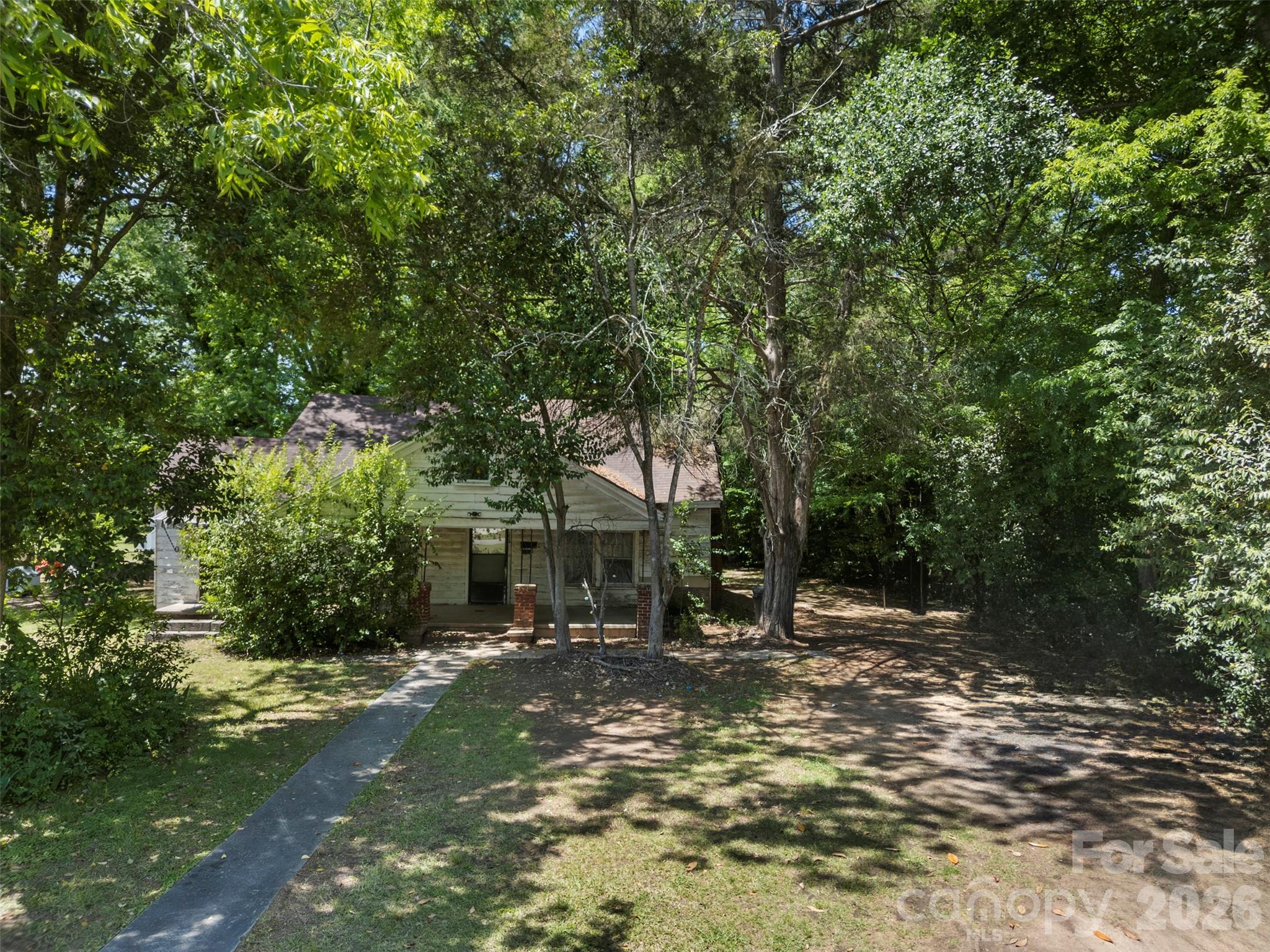 154 Loomis Street Chester, SC 29706 - Photo 1 of 5 a view of a tree in the middle of a yard
