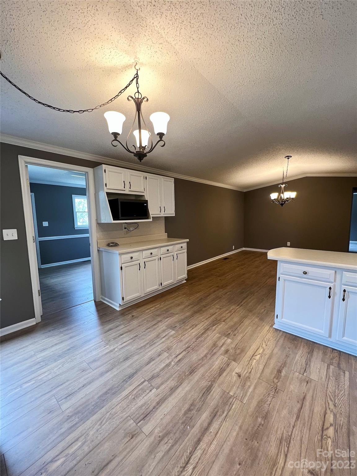 1821 Springdale Road Lancaster, SC 29720 - Photo 10 of 33 a kitchen with stainless steel appliances granite countertop a stove and a wooden floors