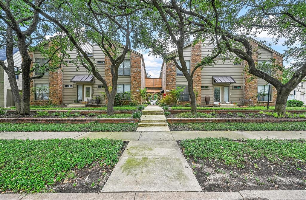 4047 Herschel Avenue, Unit 12 Dallas, TX 75219 - Photo 1 of 15 a front view of a house with a yard