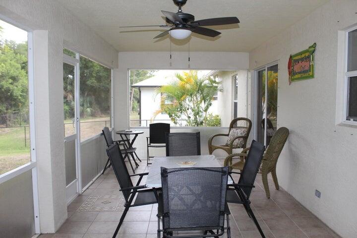 5300 Seagrape Drive Fort Pierce, FL 34982 - Photo 16 of 17 a view of a dining room with furniture window and outside view