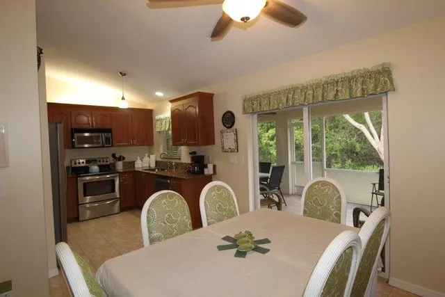 a kitchen with a table and chairs