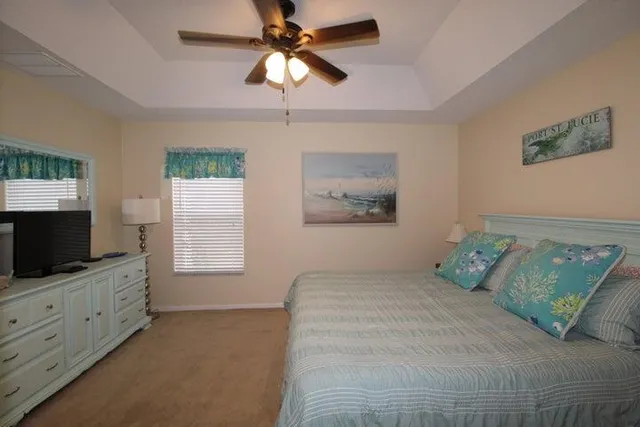 a bedroom with a large bed and a flat screen tv