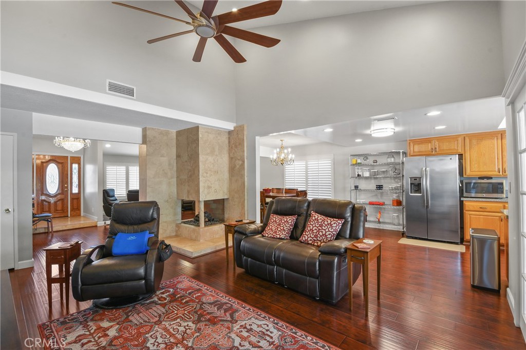 13092 Ranchwood Road Tustin, CA 92782 - Photo 5 of 17 a living room with furniture and wooden floor