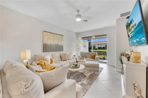 a living room with furniture and a large window