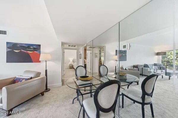 a living room with furniture and a table