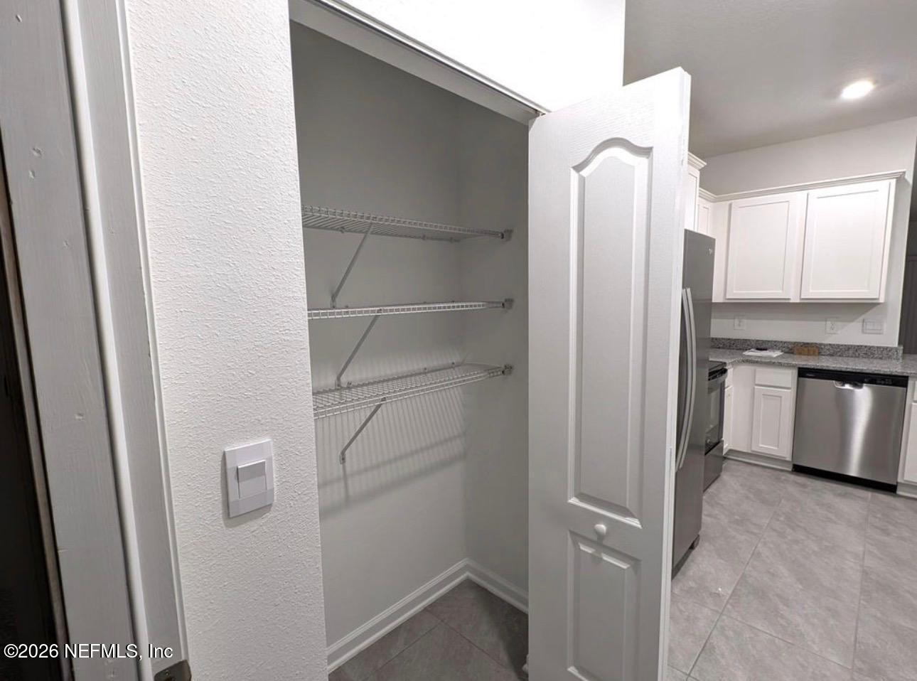 59 Sunnyvale Street St. Augustine, FL 32095 - Photo 11 of 22 a view of cabinets and refrigerator
