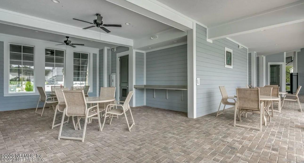 59 Sunnyvale Street St. Augustine, FL 32095 - Photo 19 of 22 a dining room with furniture and front view of a house