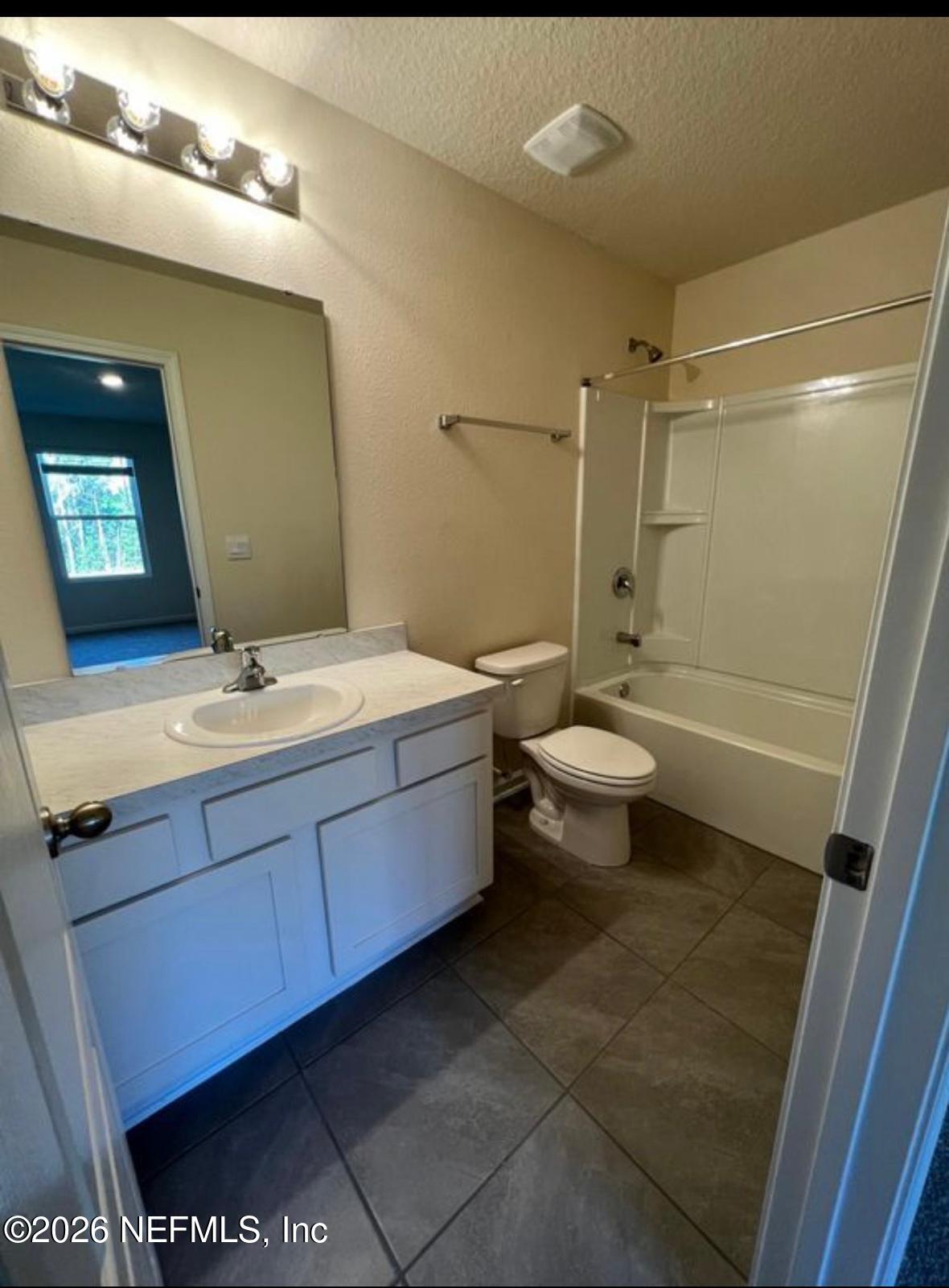 59 Sunnyvale Street St. Augustine, FL 32095 - Photo 22 of 22 a bathroom with a double vanity sink toilet and shower