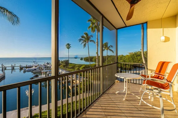 a en suite bathroom with a granite countertop double vanity