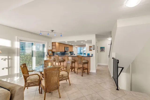 a kitchen with kitchen island granite countertop a sink and counter space