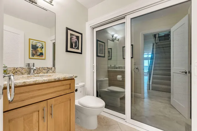 a spacious bedroom with a bed and a refrigerator