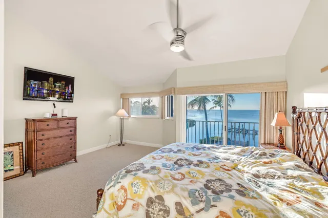 a en suite bathroom with a granite countertop double vanity