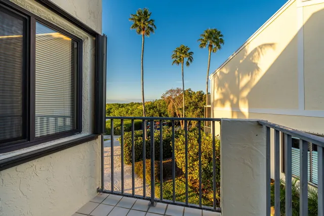 a terrace with outdoor seating and city view