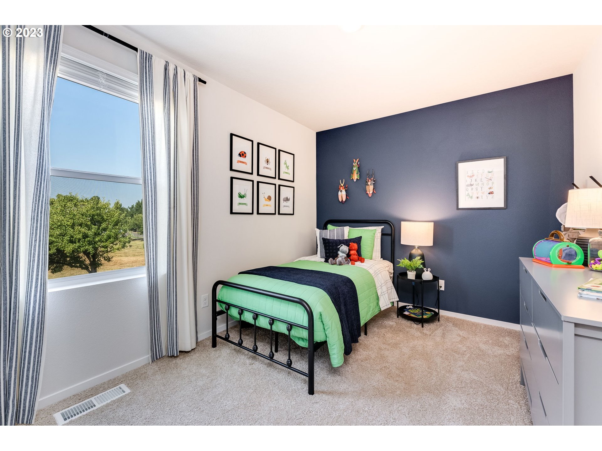 17515 Northwest 10th Place Ridgefield, WA 98642 - Photo 15 of 27 a bedroom with bed and a window