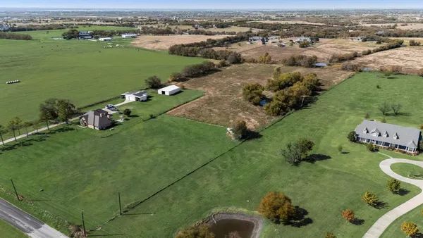 an aerial view of a houses with outdoor space