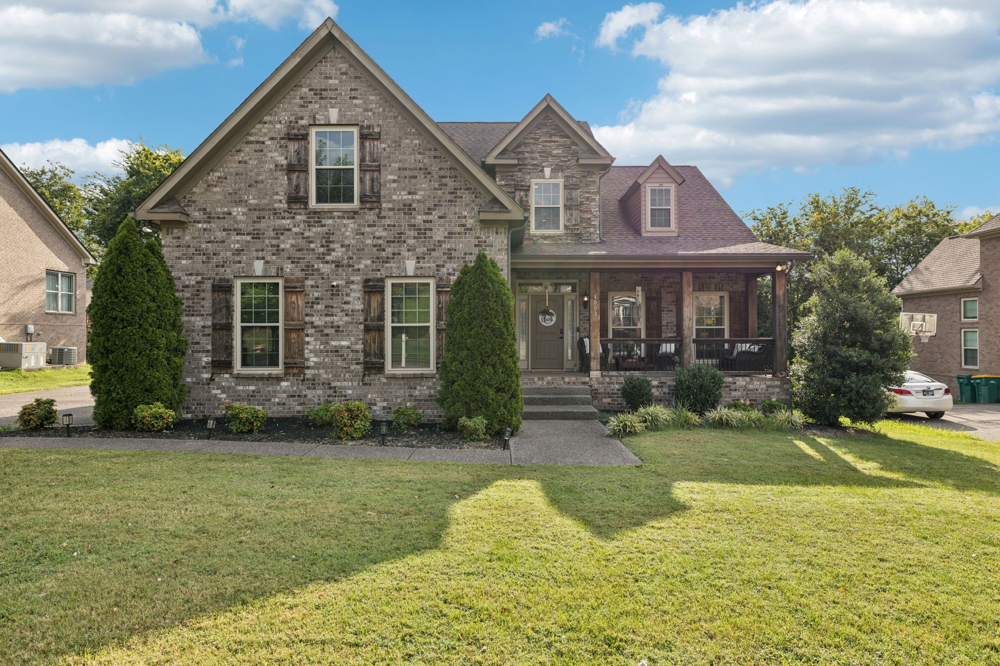 a front view of a house with garden
