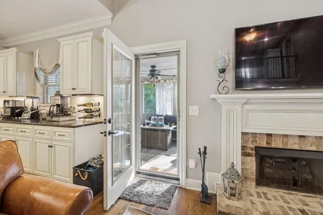 a living room with furniture fireplace and flat screen tv