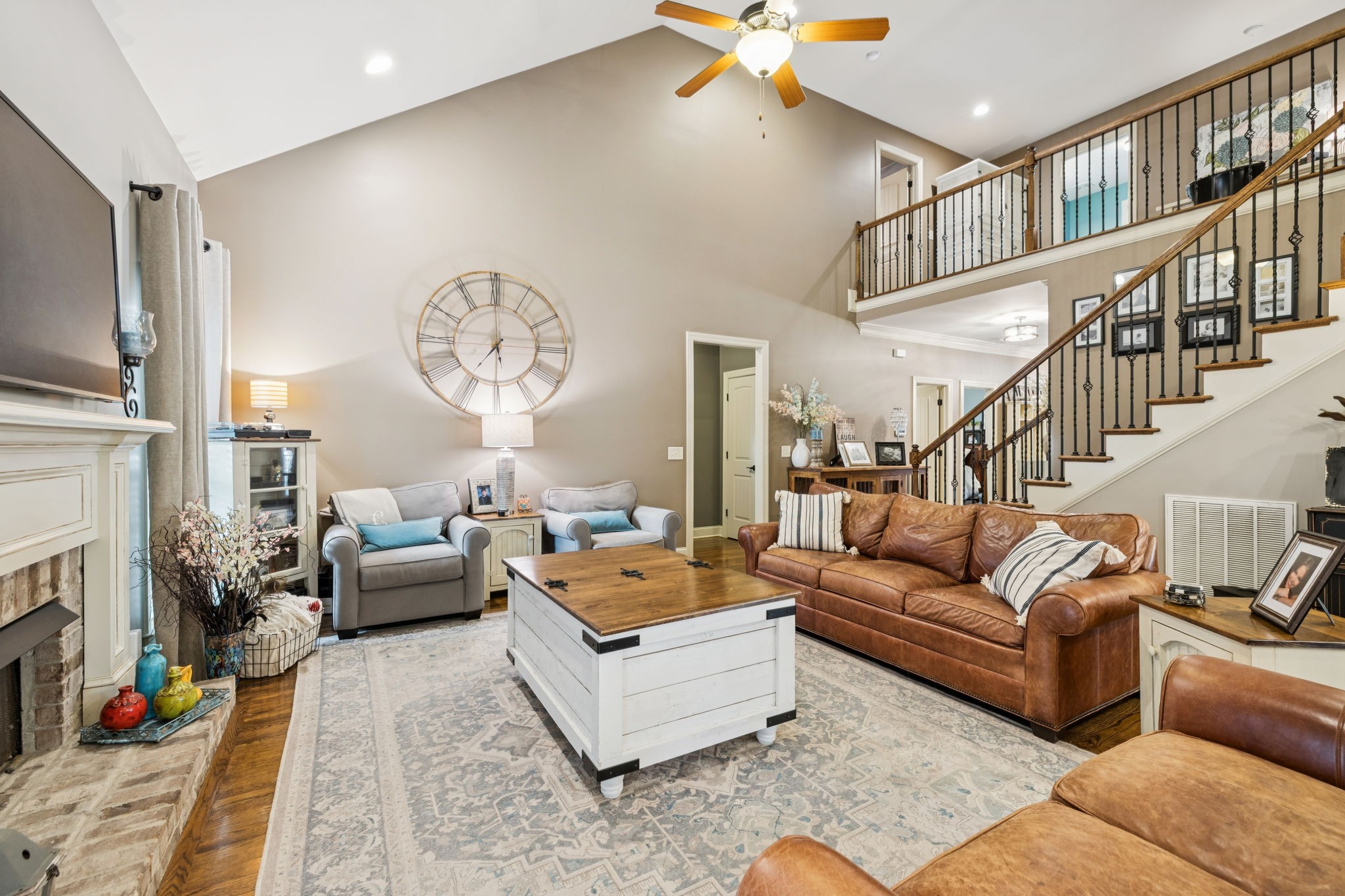 4003 Campania Strada Spring Hill, TN 37174 - Photo 13 of 50 a living room with furniture fireplace and a chandelier