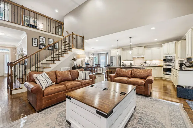 a kitchen with kitchen island granite countertop lots of counter top space and stainless steel appliances