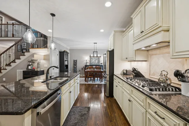 a large kitchen with granite countertop lots of counter top space