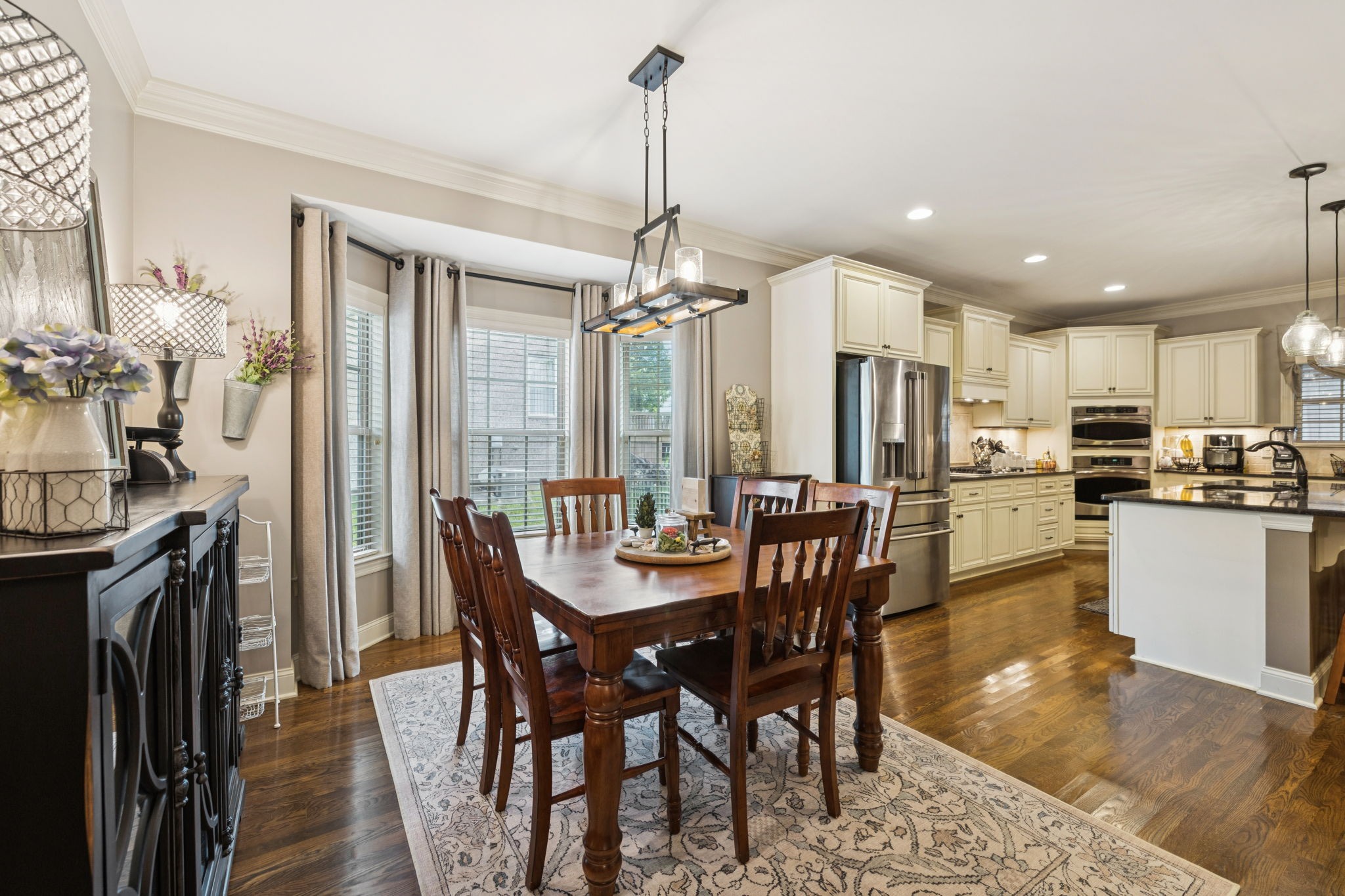 4003 Campania Strada Spring Hill, TN 37174 - Photo 24 of 50 a view of a dining room with furniture window and wooden floor