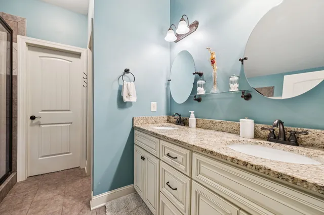 a bathroom with a glass shower door