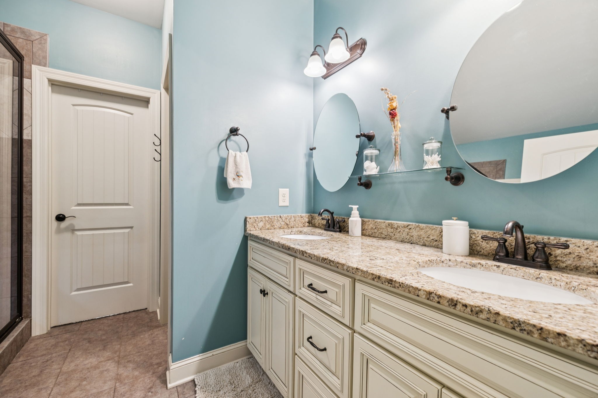 4003 Campania Strada Spring Hill, TN 37174 - Photo 28 of 50 a bathroom with a granite countertop sink and a mirror